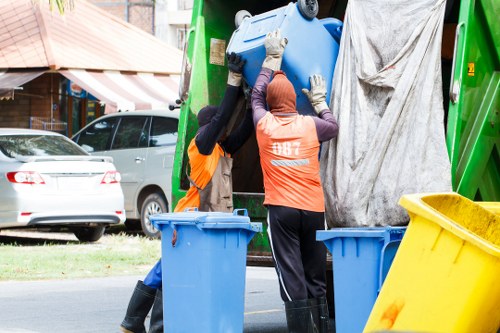 Workers sorting commercial recycling streams
